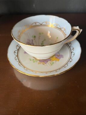 Vintage Porcelain Teacup and Saucer with Gold Trim and Purple Floral Accent